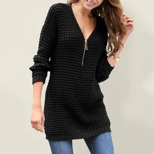 Detailed view of women's black V-neck knitted sweater with gold zipper accent
