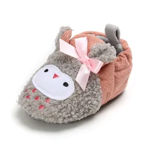 Pink and grey plush baby shoes with cartoon owl design and decorative bow detail.