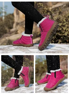 Detailansicht von rosa Winterstiefeln mit Kunstfellfutter und weichen Sohlen auf Schnee