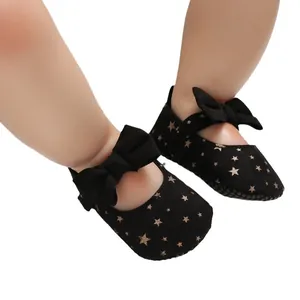 Schwarze Babyprinzessin-Lauflernschuhe mit goldenen Sternen und dekorativer Schleife