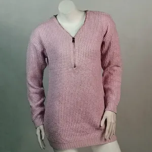 Close-up detail of women's pink waffle knit sweater featuring a half-zip V-neck design