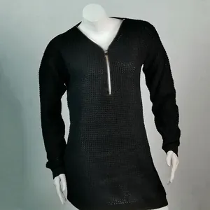 Close-up of black V-neck knitted sweater featuring a functional front zipper detail
