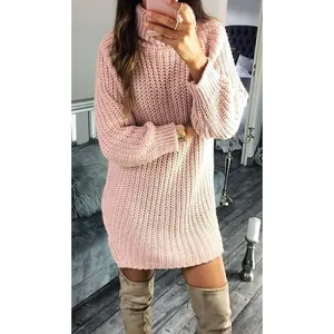 Cozy pink oversized turtleneck knit sweater dress styled with beige thigh-high boots