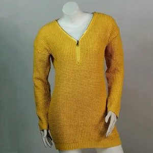 Detail shot of the yellow V-neck knit sweater featuring a front zipper and waffle texture.
