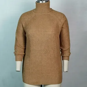 Detailed close-up of ribbed turtleneck and knit texture on this camel colored sweater