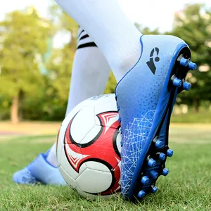Durable youth soccer shoes with AG studs for artificial grass training in vibrant blue