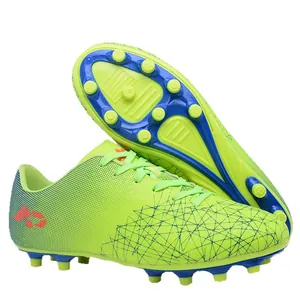 Youth soccer shoes in lime green with AG cleats for artificial grass training and matches