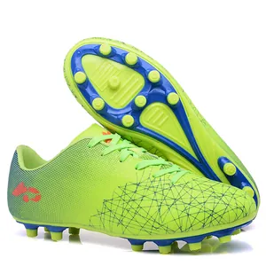 Lime green children's soccer shoes for outdoor training with studded blue soles