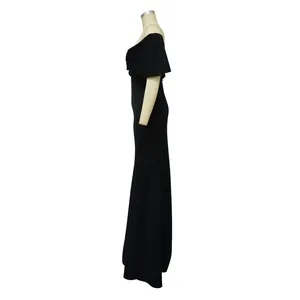 Side profile of an elegant black off-shoulder mermaid knit evening gown on a mannequin