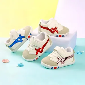 Four pairs of colorful toddler walking shoes displayed on a tiered multi-color background