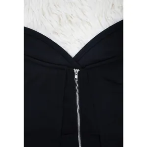 Close-up detail of silver zipper on a sexy black knit evening dress for formal parties