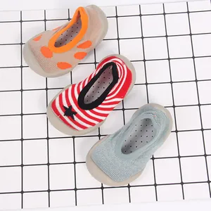 Overhead detail view of three colorful breathable knit baby floor sock shoes with rubber soles