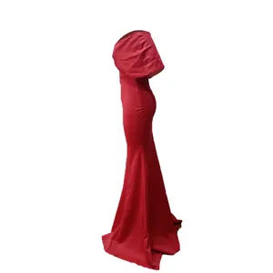 Elegant red mermaid evening dress shown from a side view highlighting the sleek silhouette.