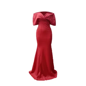 Detailed view of the red off-the-shoulder mermaid dress with floor-length hemline.