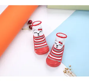 Detailed view of red striped cartoon cat baby sock shoes with flexible non-slip soles