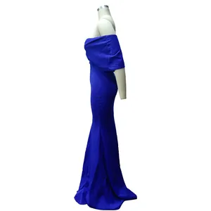 Detailed side profile of an elegant royal blue off-shoulder mermaid evening gown on mannequin