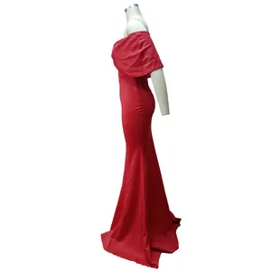 Side view of an elegant red off-the-shoulder mermaid evening gown on a mannequin