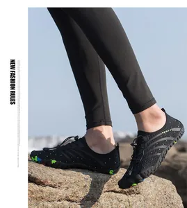Professional quick-drying water shoes for swimming and wading shown on rocky terrain