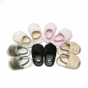 Collection of soft furry baby sandals in various colors for infants aged 0 to 6 months.