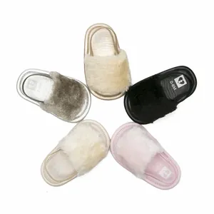 Detailed view of fuzzy baby sandals in multiple colors for infants aged 0-6 months