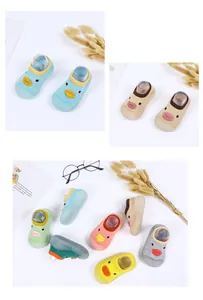 Detail view of colorful cartoon duck baby walker sock shoes with breathable mesh and soft soles