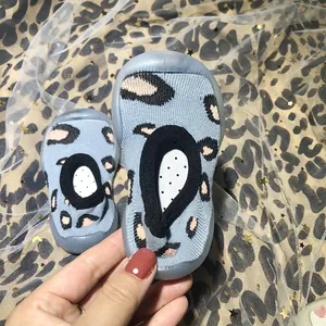Breathable leopard print baby sock shoes with soft rubber soles for walking.