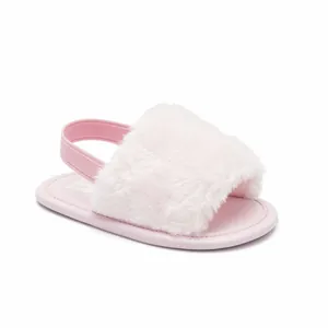 Close-up of pink fuzzy baby sandal with elastic heel strap designed for infants