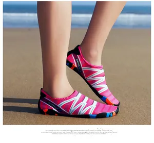 Close-up of pink quick-drying water shoes designed for beach wading and snorkeling activities