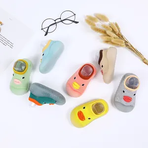 Detailed overhead view of various colorful baby sock shoes featuring cute duck face designs