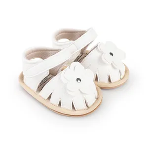 White baby pre-walker sandals with decorative flower detail for 0-1 year old infants