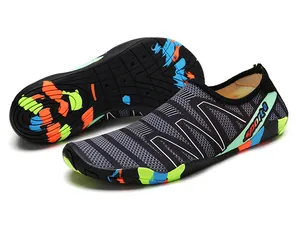 Detail view of quick-dry water shoes featuring a non-slip rubber sole for beach swimming
