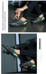 Close-up detail of gray barefoot diving shoes with multi-color sole for swimming and beach.
