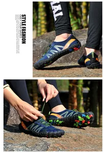 Detailed close-up of quick-dry outdoor water shoes on rocks featuring adjustable bungee laces.