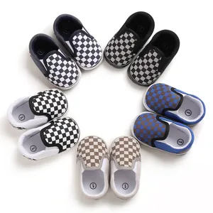 Multiple colors of checkerboard pattern soft sole slip-on baby walking shoes arranged in a circle