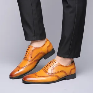 Men's brown leather Oxford shoes with brogue detailing for business casual wear