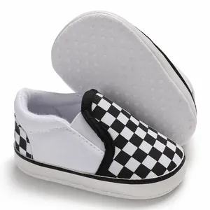 Close-up of checkered baby walking shoes with soft non-slip soles for infants
