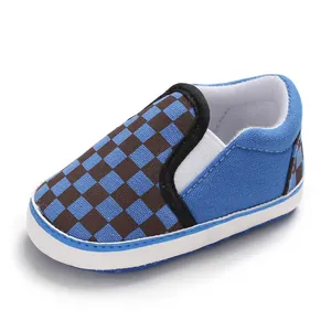 Detailed side view of blue checkerboard baby slip-on shoes with soft soles
