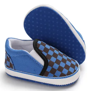 Detailed view of blue checkered baby pre-walker shoes with anti-slip soft soles