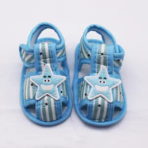 Detailed view of blue striped baby sandals with a cute smiling starfish design on top