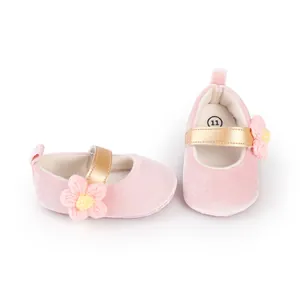 Soft pink baby walker shoes with elastic gold strap and decorative crochet flower