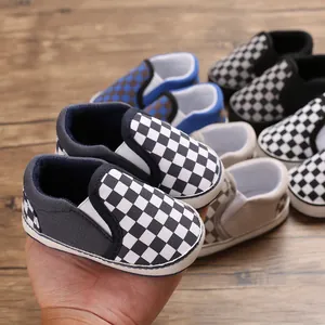Detailed view of multiple colors of checkerboard slip-on soft sole baby walking shoes.