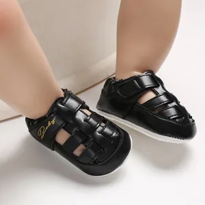 Close-up of black infant closed-toe sandals featuring Baby embroidery and non-slip soles