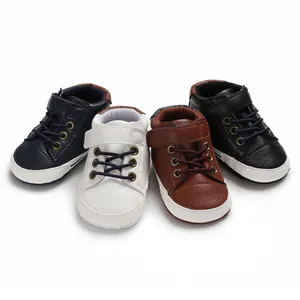 Close-up detail of high-top leather baby walker shoes in four classic color variants