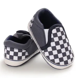 Detailed macro shot of baby checkerboard slip-on walking shoes with soft rubber soles