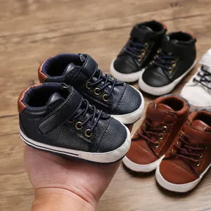 Macro view of soft-sole leather high-top baby walking shoes in multiple colors