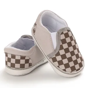 Detailed view of baby checkerboard pattern slip-on walking shoes with soft sole design