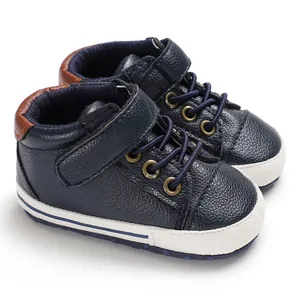 Detailed macro view of navy blue high-top baby walker shoes featuring premium leather texture