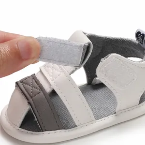 Close-up of baby walking sandal featuring a functional adjustable velcro strap for easy wear