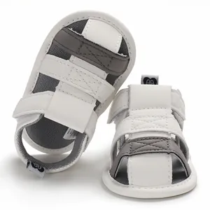 Detailed macro view of white and grey soft-sole baby sandals for summer toddlers