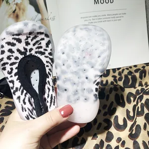 Detail of leopard print baby sock shoes with translucent non-slip soft rubber sole